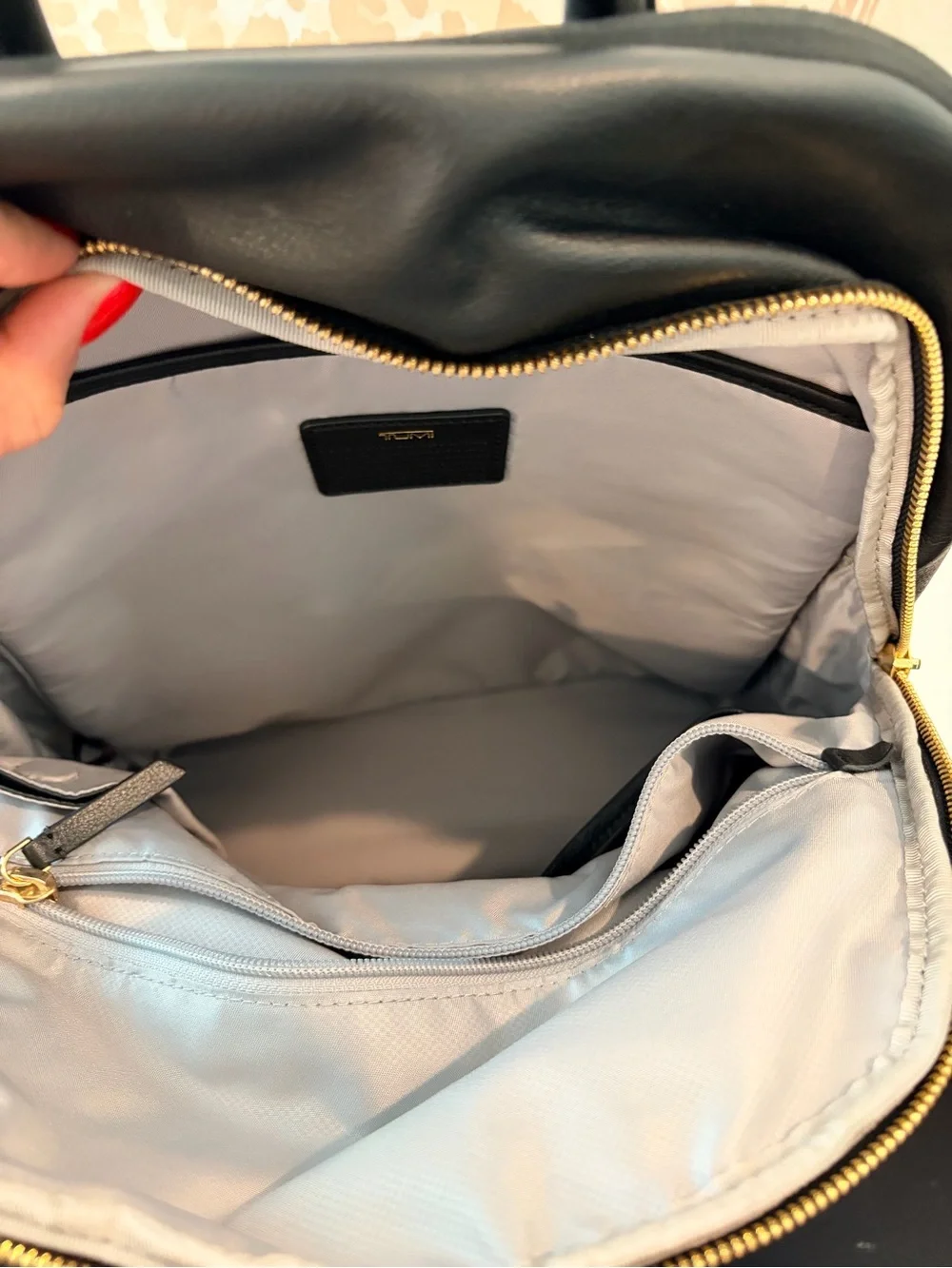 Tumi Black Leather Backpack with Gold Hardware